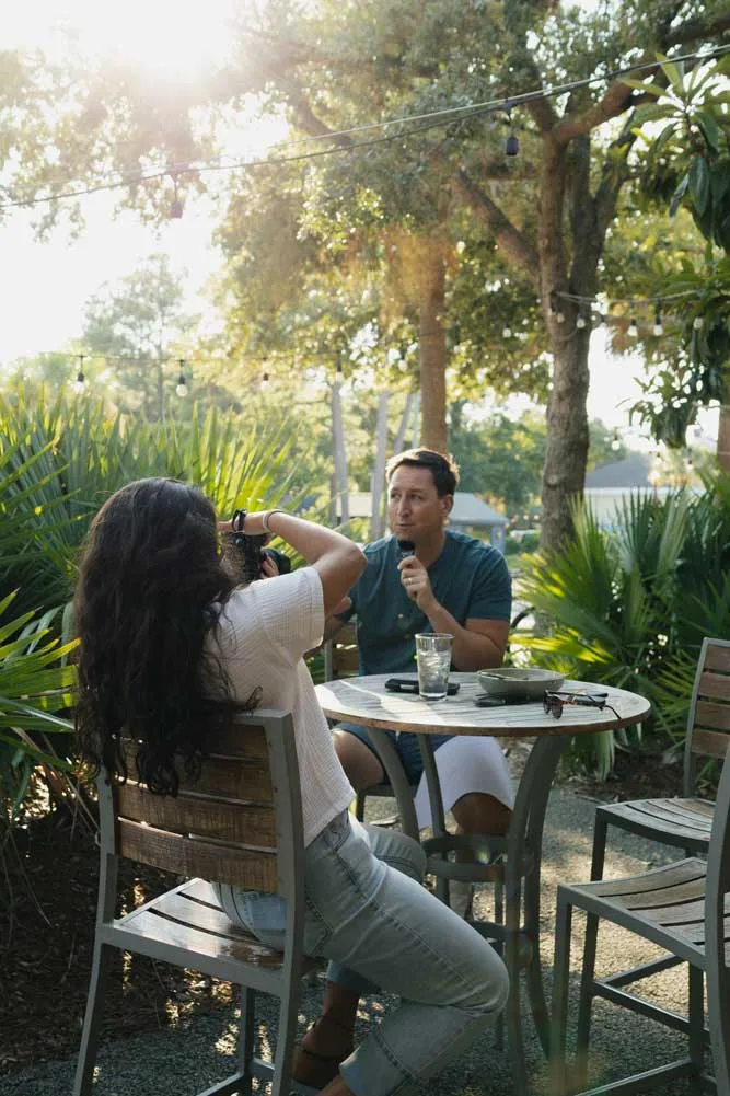 Photographer at Matchstick Social setting up a photo of Dr. Will Bulsiewicz