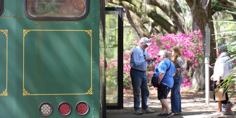 Visitors boarding a trolley at Charleston Tea Garden, captured as b-roll video used to create short videos that showcase the experience of visiting the tea fields.