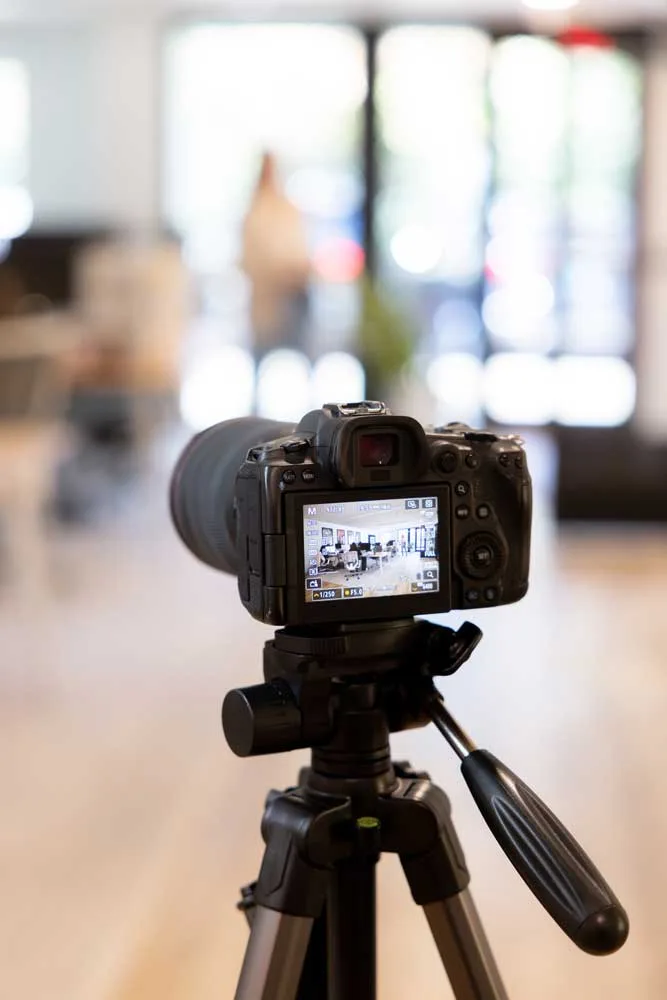 DSLR camera set up on a tripod with the background blurred out