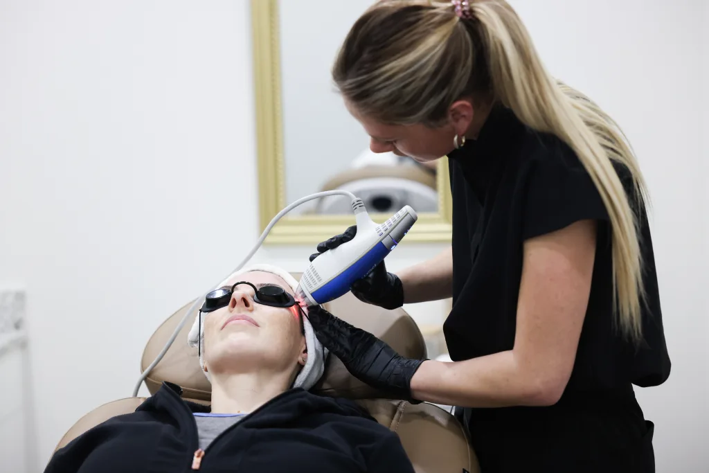 Aesthetic's provider performing a laser service on a patient