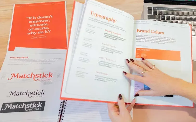Matchstick Social's brand guide lays flat on a table