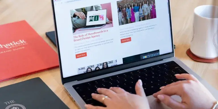Digital marketer reviewing blog content and SEO performance data, illustrating how blogging helps SEO and drives organic traffic.