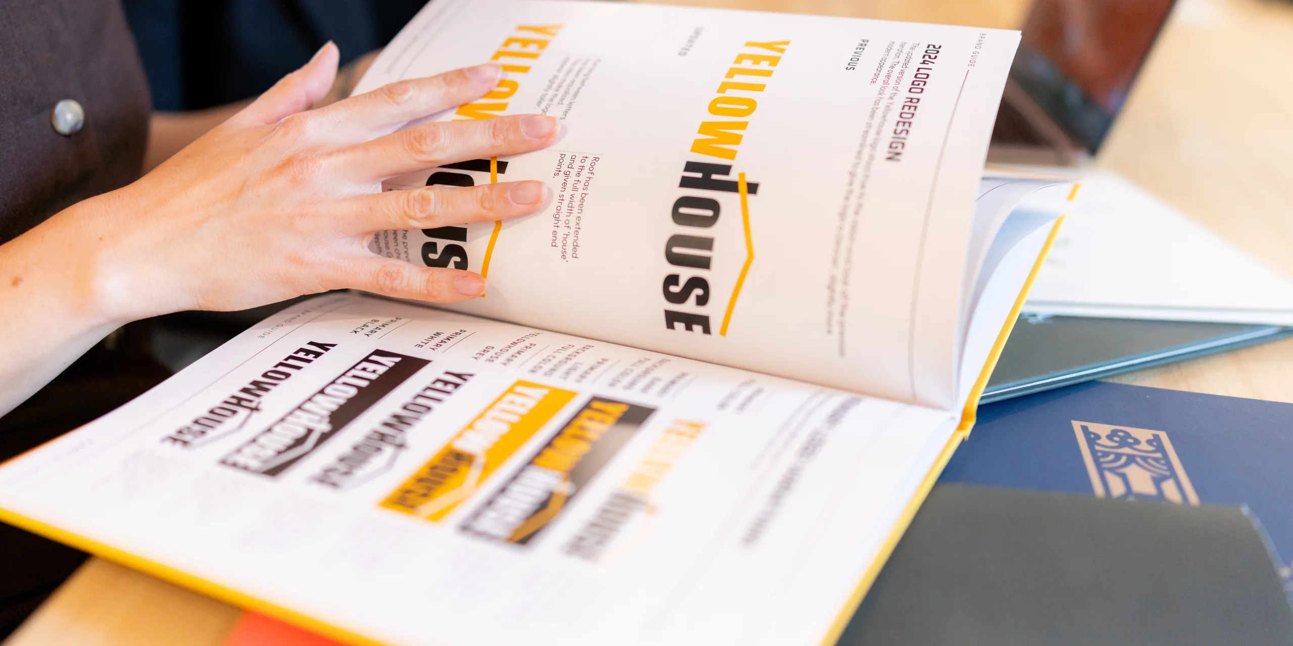 Brand strategist reviewing brand identity concepts during a brand refresh to modernize outdated branding.